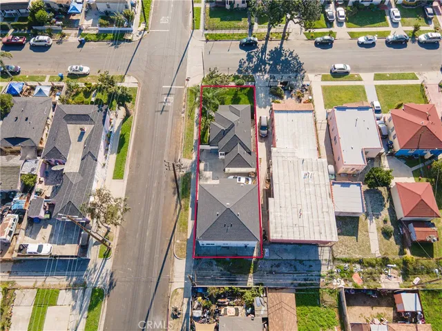 an aerial view of houses with outdoor space