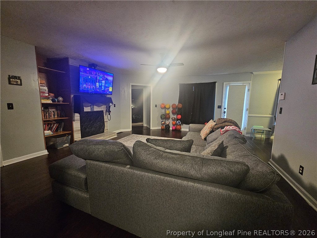 7490 Fairpoint Road Fayetteville, NC 28314 - Photo 2 of 9 a living room with furniture and a fireplace