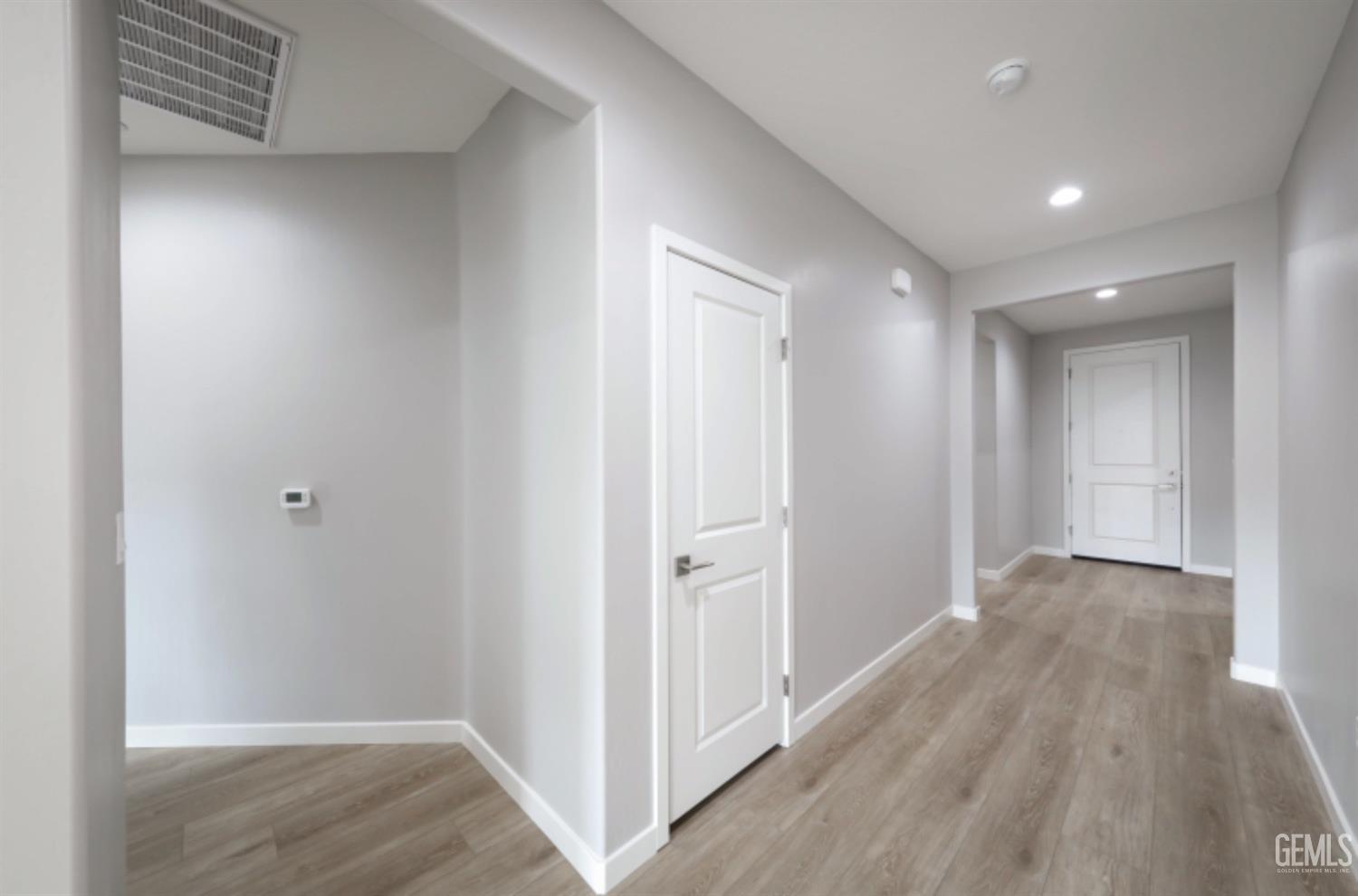 Undisclosed Address Shafter, CA 93263 - Photo 14 of 33 a view of hallway with wooden floor