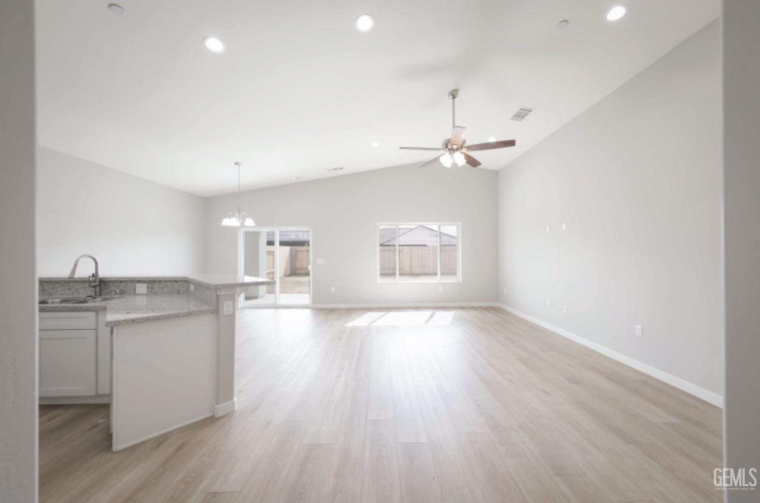 Undisclosed Address Shafter, CA 93263 - Photo 21 of 33 wooden floor in an empty room with a window