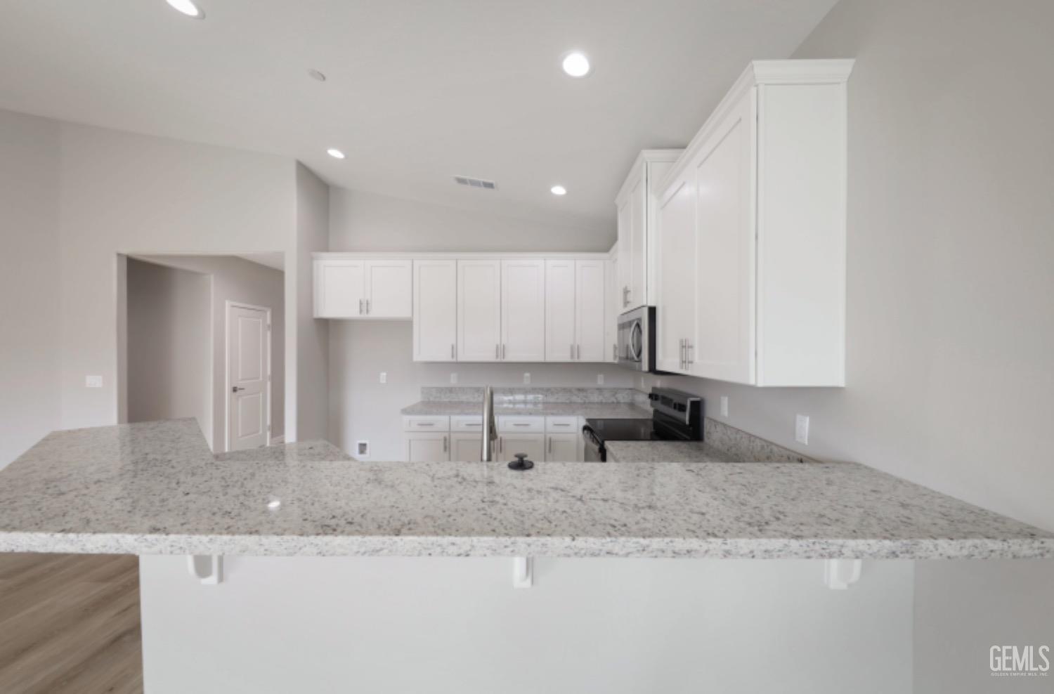 Undisclosed Address Shafter, CA 93263 - Photo 26 of 33 a kitchen with granite countertop sink and cabinets