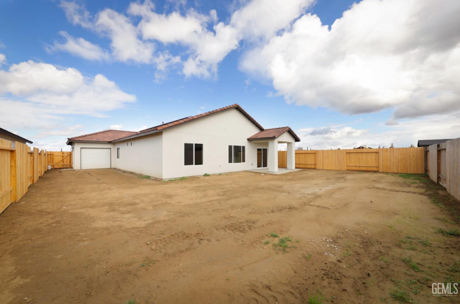 Undisclosed Address Shafter, CA 93263 - Photo 32 of 33 a view of a house with a backyard