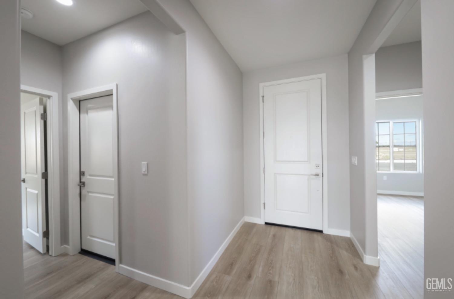 Undisclosed Address Shafter, CA 93263 - Photo 5 of 33 a view of a hallway with wooden floor