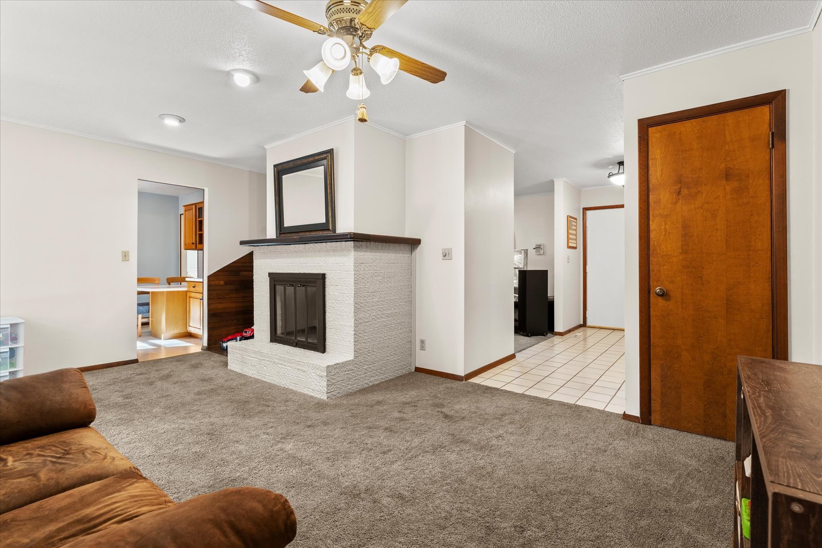 1108 Riverside Court Mahomet, IL 61853 - Photo 18 of 50 a living room with furniture and a fireplace