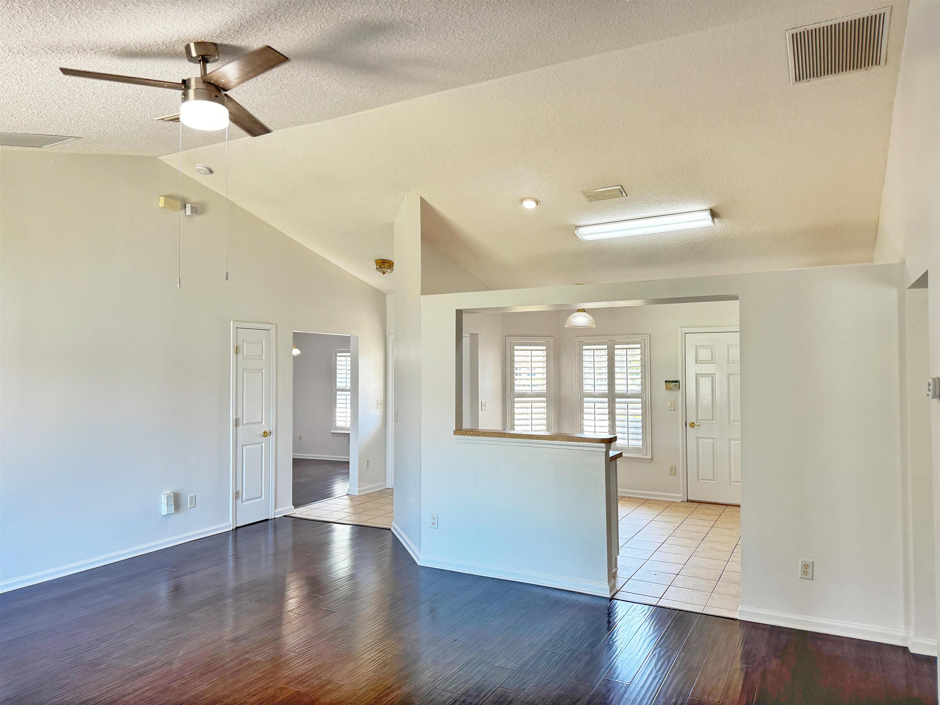 1709 South Summer Ridge Court St. Augustine, FL 32092 - Photo 12 of 27 a view of an empty room with wooden floor and a window