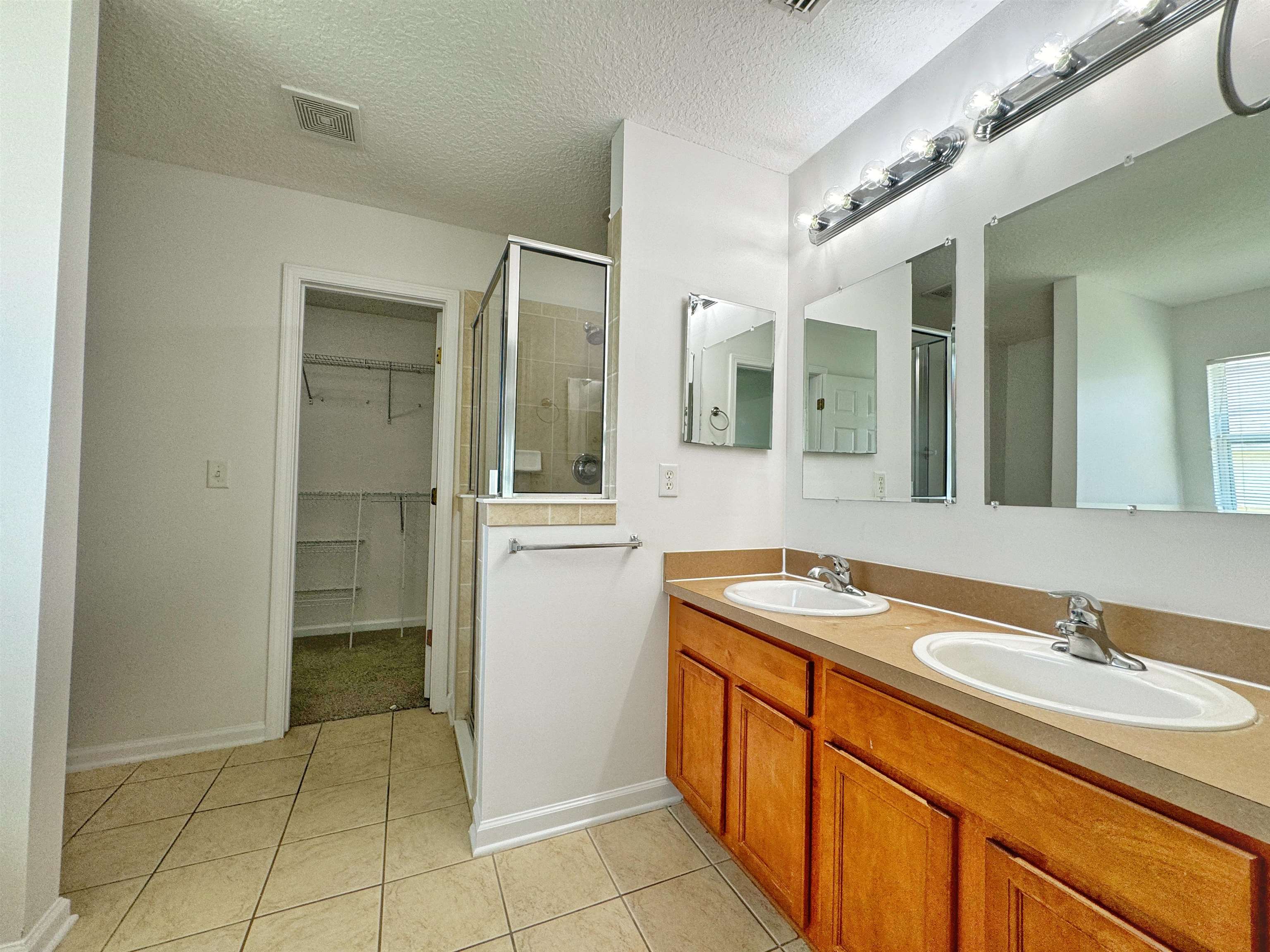 1709 South Summer Ridge Court St. Augustine, FL 32092 - Photo 16 of 27 a bathroom with a sink and a mirror