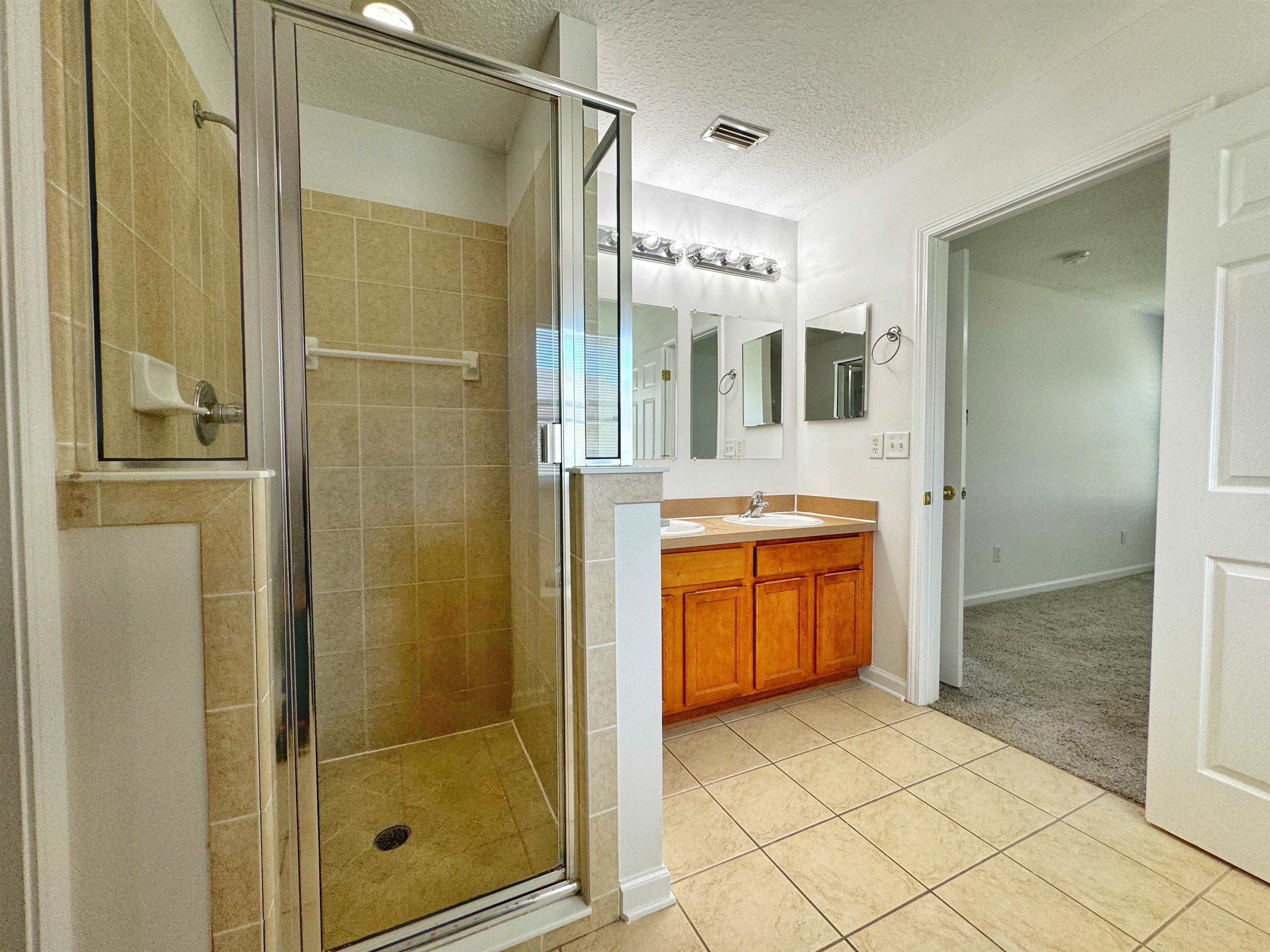 1709 South Summer Ridge Court St. Augustine, FL 32092 - Photo 19 of 27 a bathroom with a shower and a sink