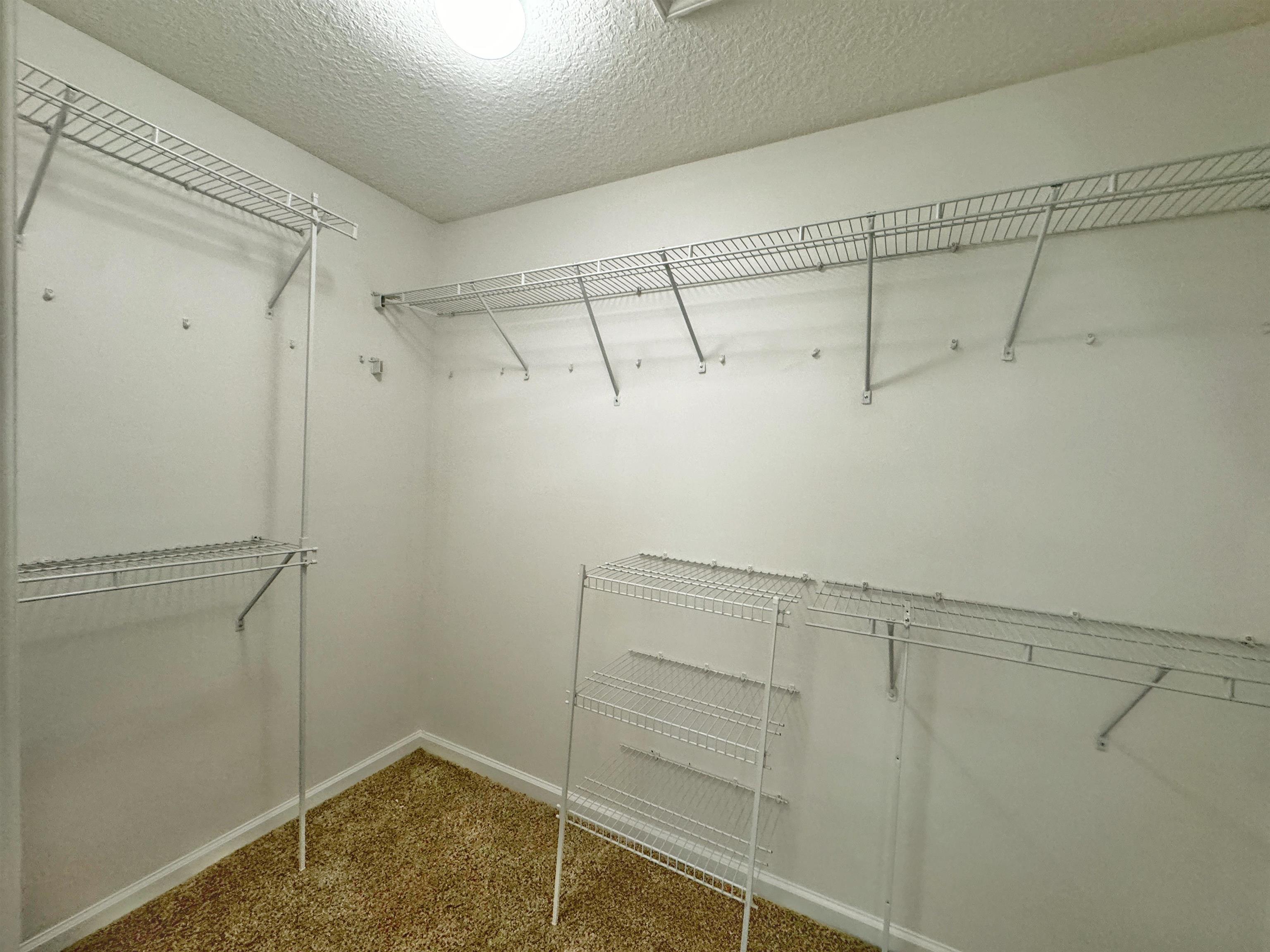 1709 South Summer Ridge Court St. Augustine, FL 32092 - Photo 20 of 27 a view of a room with racks on the wall