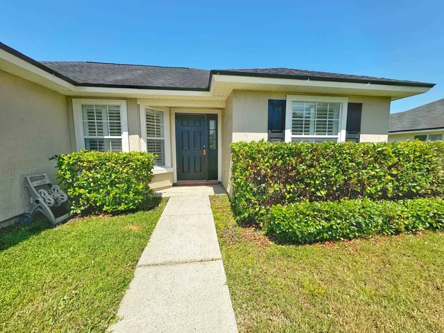 front view of a house with a yard
