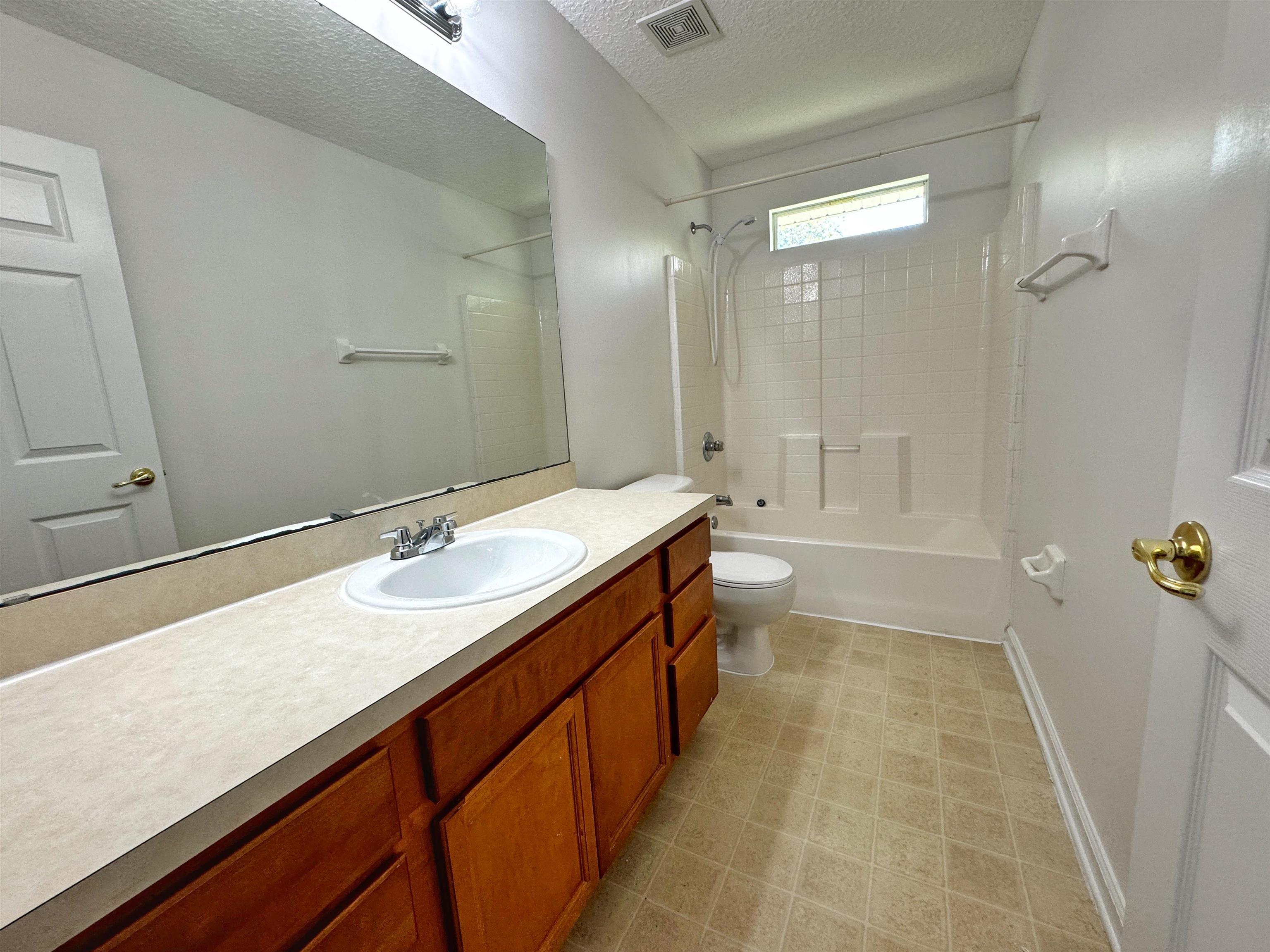 1709 South Summer Ridge Court St. Augustine, FL 32092 - Photo 23 of 27 a bathroom with a tub sink and mirror