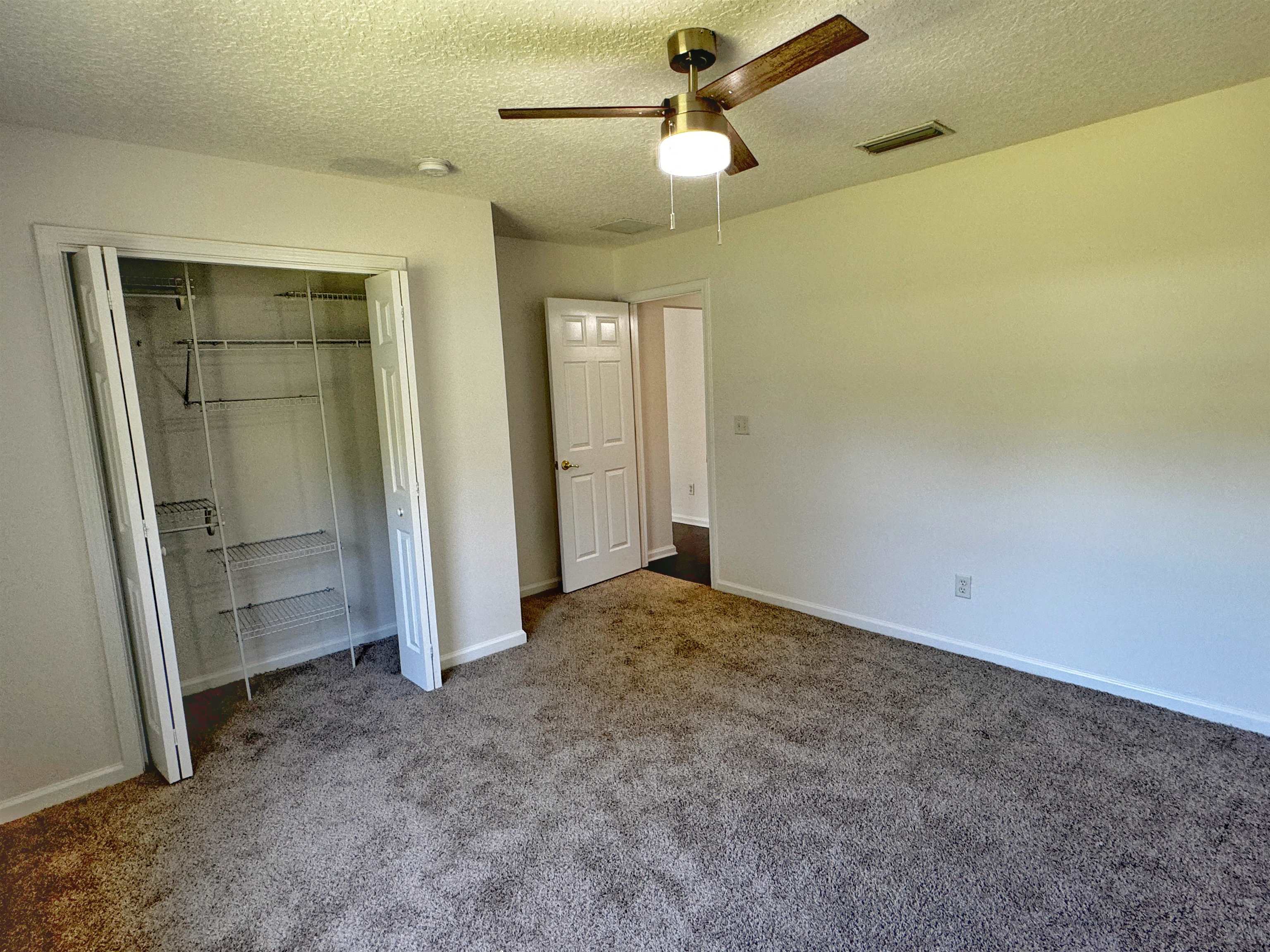 1709 South Summer Ridge Court St. Augustine, FL 32092 - Photo 24 of 27 an empty room with closet and windows