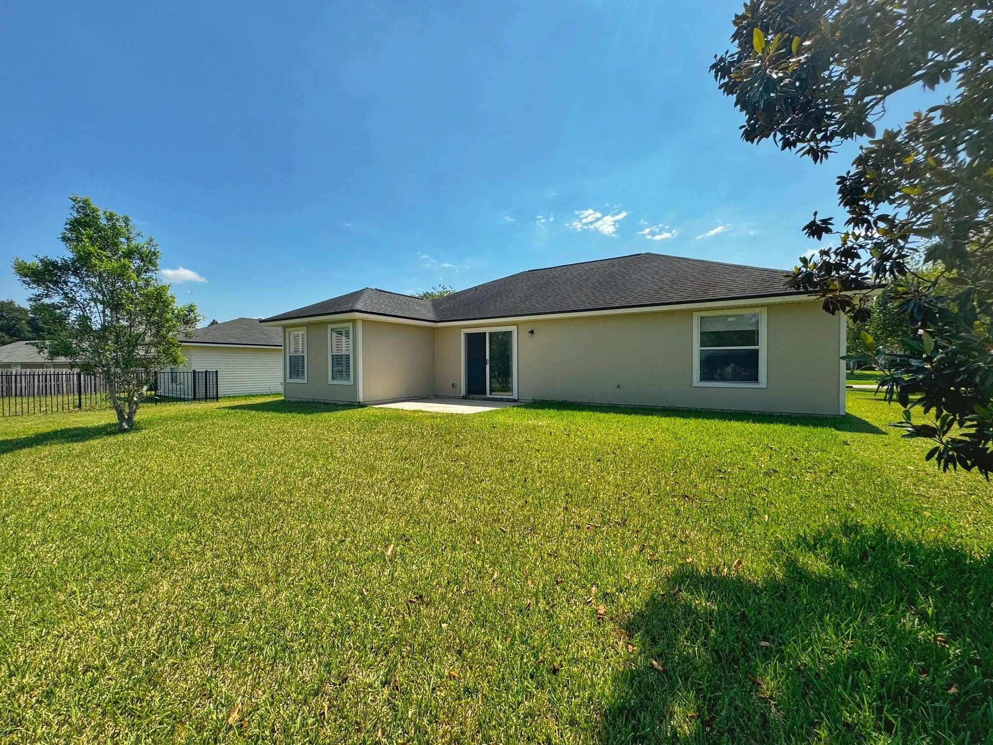 1709 South Summer Ridge Court St. Augustine, FL 32092 - Photo 26 of 27 a front view of a house with a garden