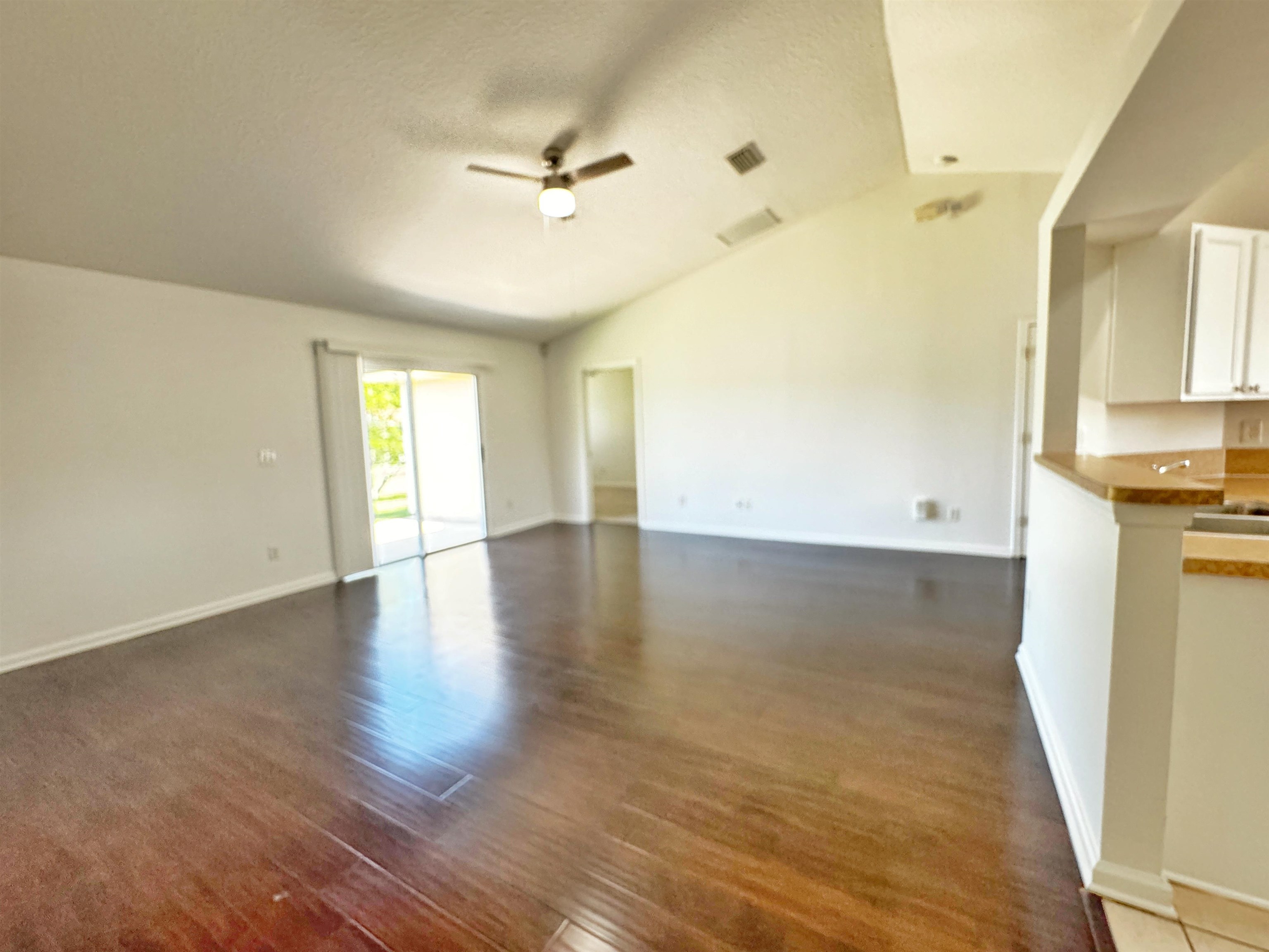 1709 South Summer Ridge Court St. Augustine, FL 32092 - Photo 8 of 27 wooden floor in an empty room with a window
