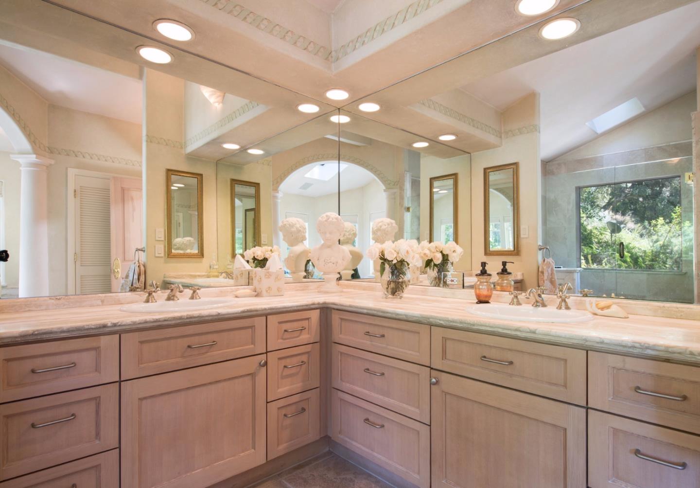 135 Summit Road Woodside, CA 94062 - Photo 13 of 27 a view of double vanity sink a mirror a window and a shower