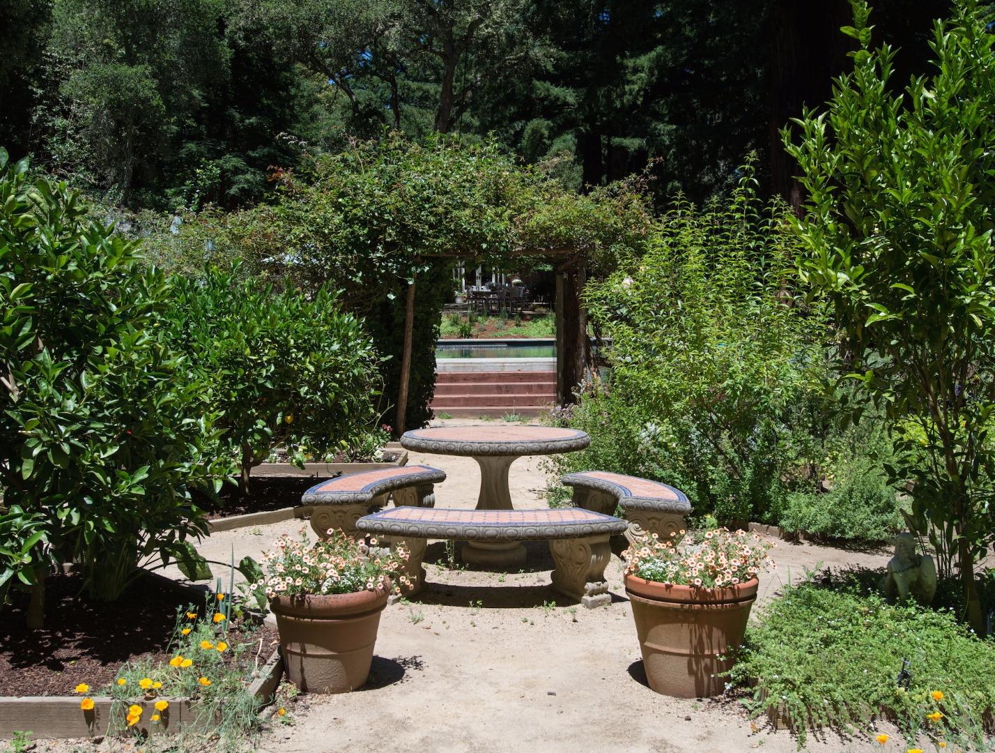 135 Summit Road Woodside, CA 94062 - Photo 22 of 27 a view of a backyard with sitting area