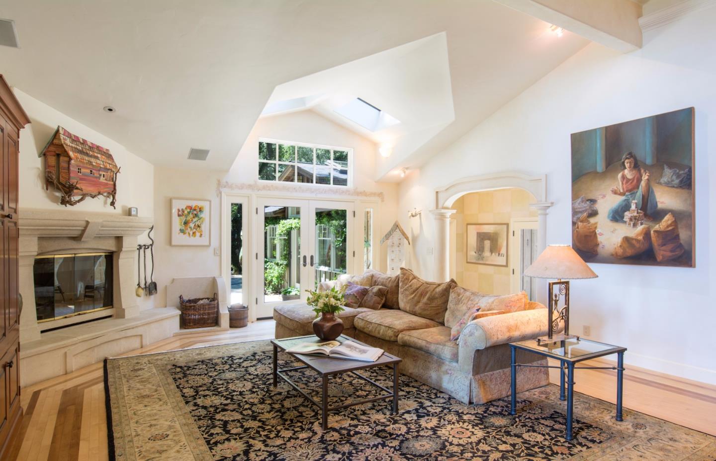 135 Summit Road Woodside, CA 94062 - Photo 9 of 27 a living room with furniture a fireplace and a flat screen tv