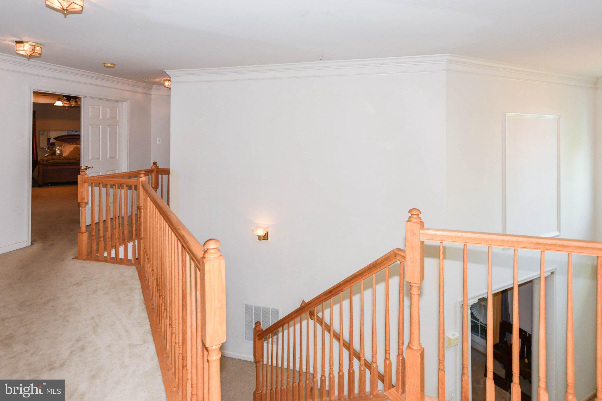 3208 Clavier Place Clinton, MD 20735 - Photo 36 of 55 Inviting staircase in a bright hallway.