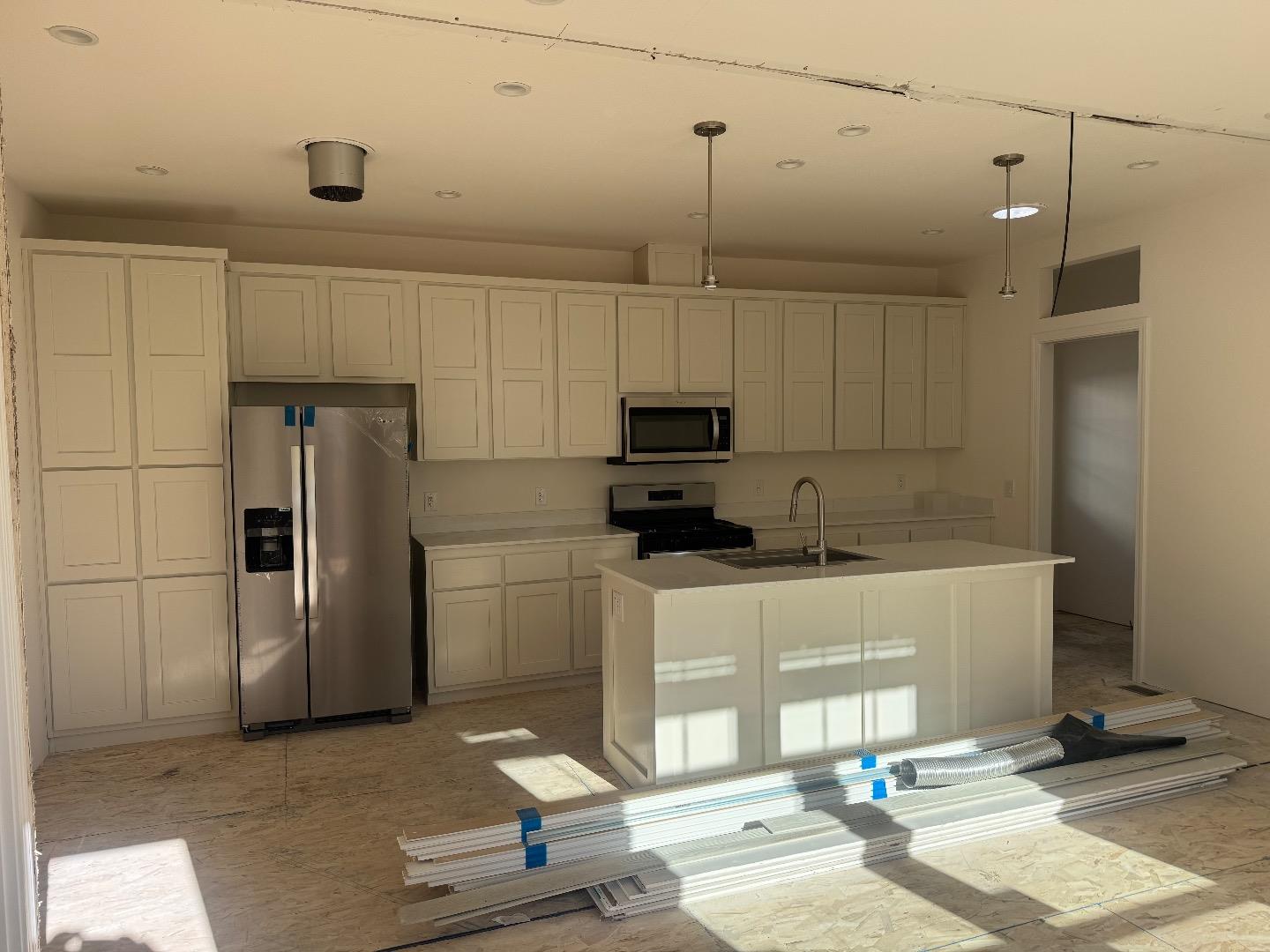 4121 Scotts Valley Drive, Unit 26 Scotts Valley, CA 95066 - Photo 3 of 4 a kitchen with stainless steel appliances a refrigerator sink and microwave
