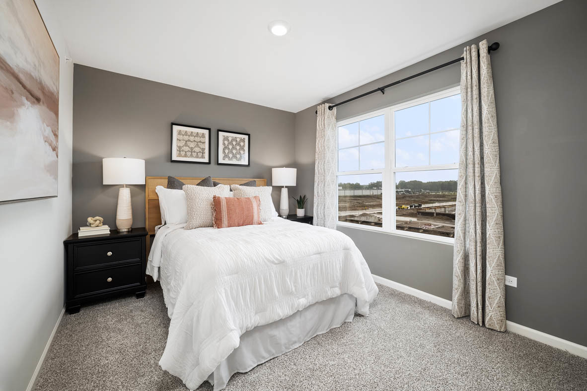 6388 Roscommon Road Tinley Park, IL 60477 - Photo 16 of 21 a bedroom with a bed and a large window