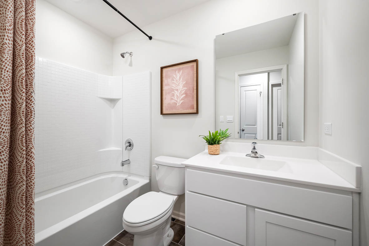 6388 Roscommon Road Tinley Park, IL 60477 - Photo 17 of 21 a bathroom with a sink a toilet and shower