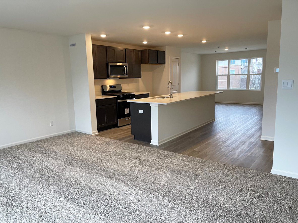 6388 Roscommon Road Tinley Park, IL 60477 - Photo 18 of 21 a large kitchen with stainless steel appliances granite countertop a large counter top a sink and a stove