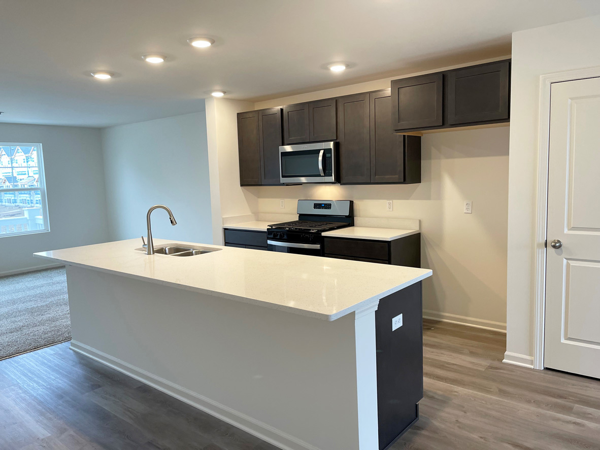 6388 Roscommon Road Tinley Park, IL 60477 - Photo 19 of 21 a kitchen with stainless steel appliances a sink a microwave a refrigerator and cabinets