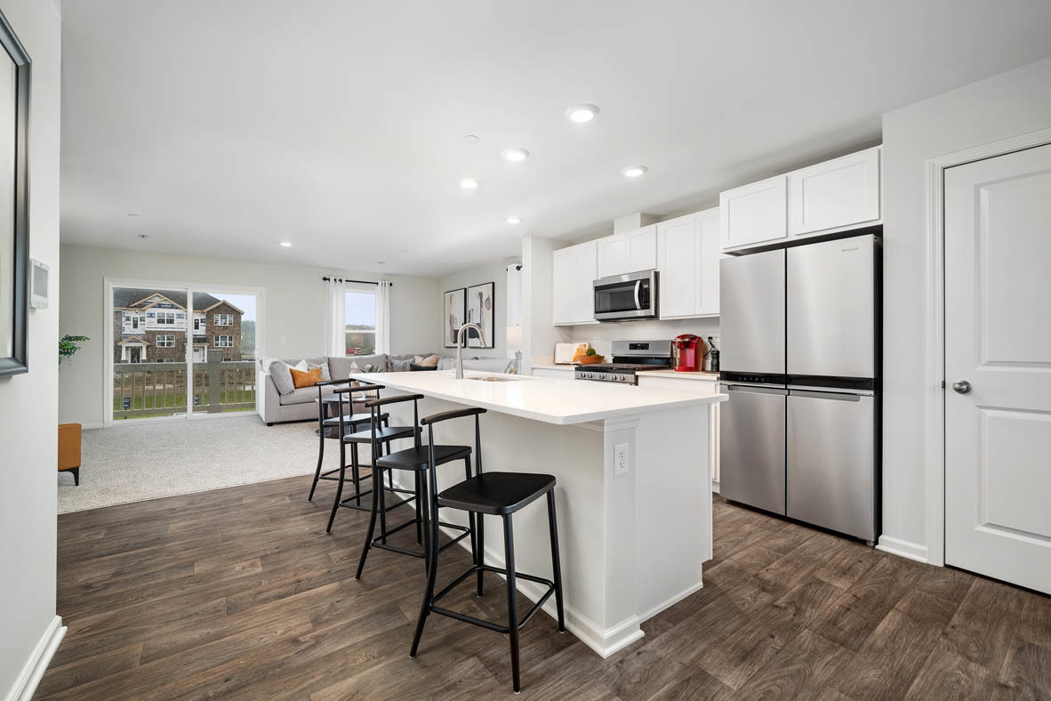 6388 Roscommon Road Tinley Park, IL 60477 - Photo 5 of 21 a kitchen with a table chairs refrigerator and dining table