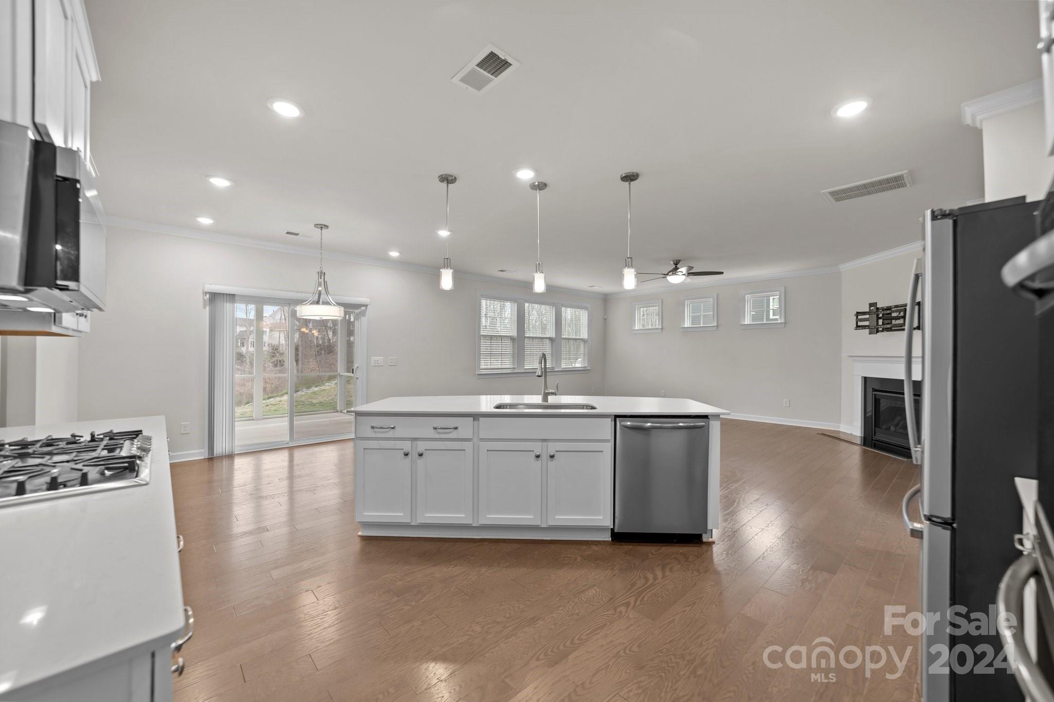 15741 Queens Trail Drive Davidson, NC 28036 - Photo 14 of 48 a large kitchen with kitchen island a sink stainless steel appliances and cabinets
