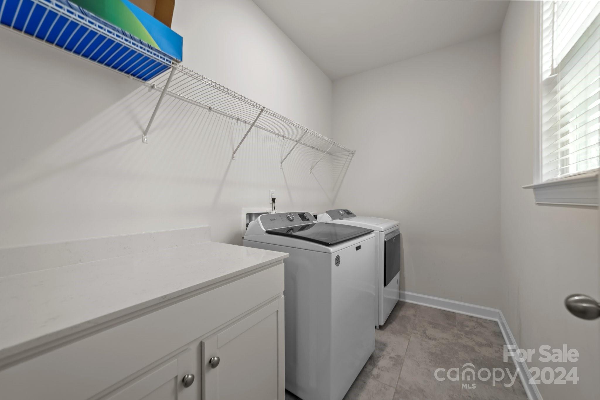 15741 Queens Trail Drive Davidson, NC 28036 - Photo 31 of 48 a utility room with dryer and washer