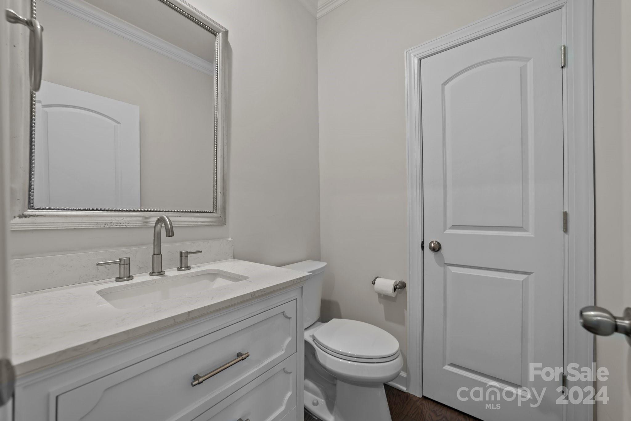 15741 Queens Trail Drive Davidson, NC 28036 - Photo 32 of 48 a bathroom with a sink a toilet and shower