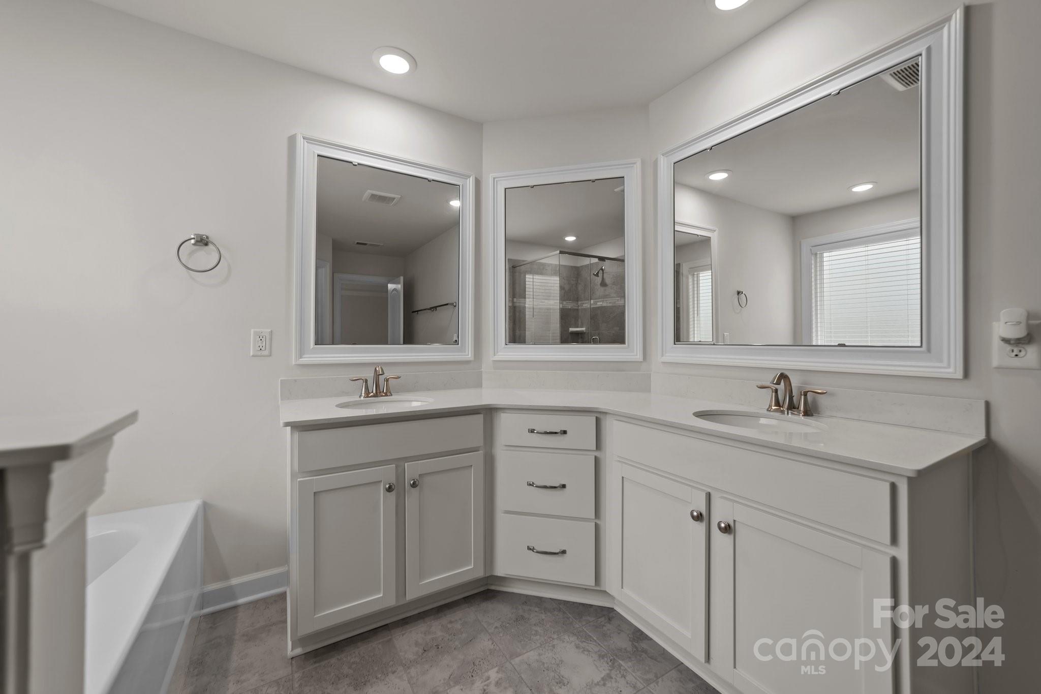 15741 Queens Trail Drive Davidson, NC 28036 - Photo 37 of 48 a bathroom with a granite countertop sink mirror and