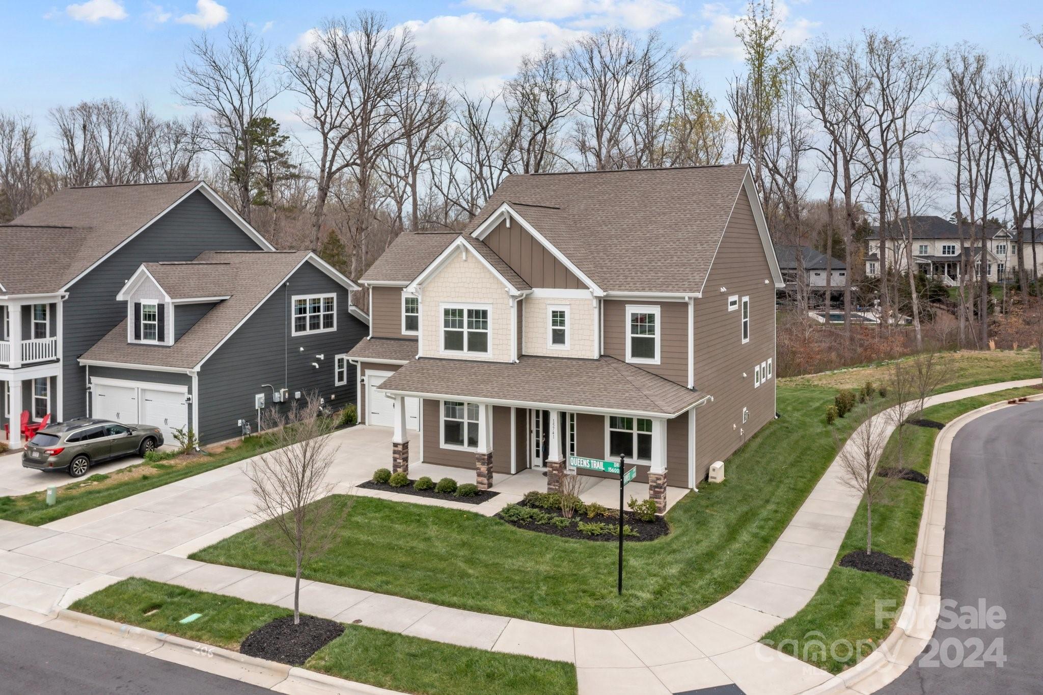 15741 Queens Trail Drive Davidson, NC 28036 - Photo 4 of 48 a front view of a house with a yard
