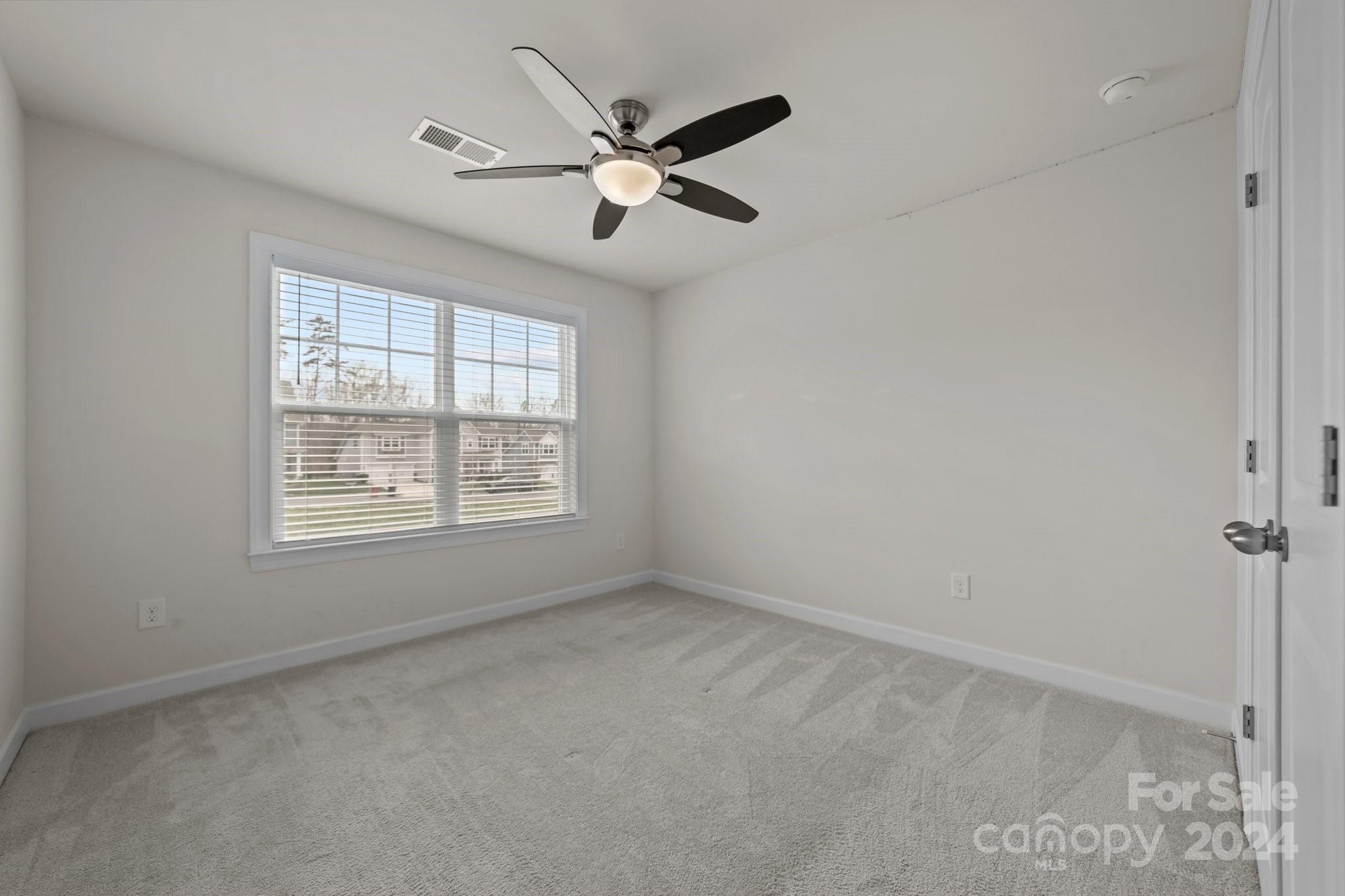 15741 Queens Trail Drive Davidson, NC 28036 - Photo 43 of 48 a view of an empty room with a window