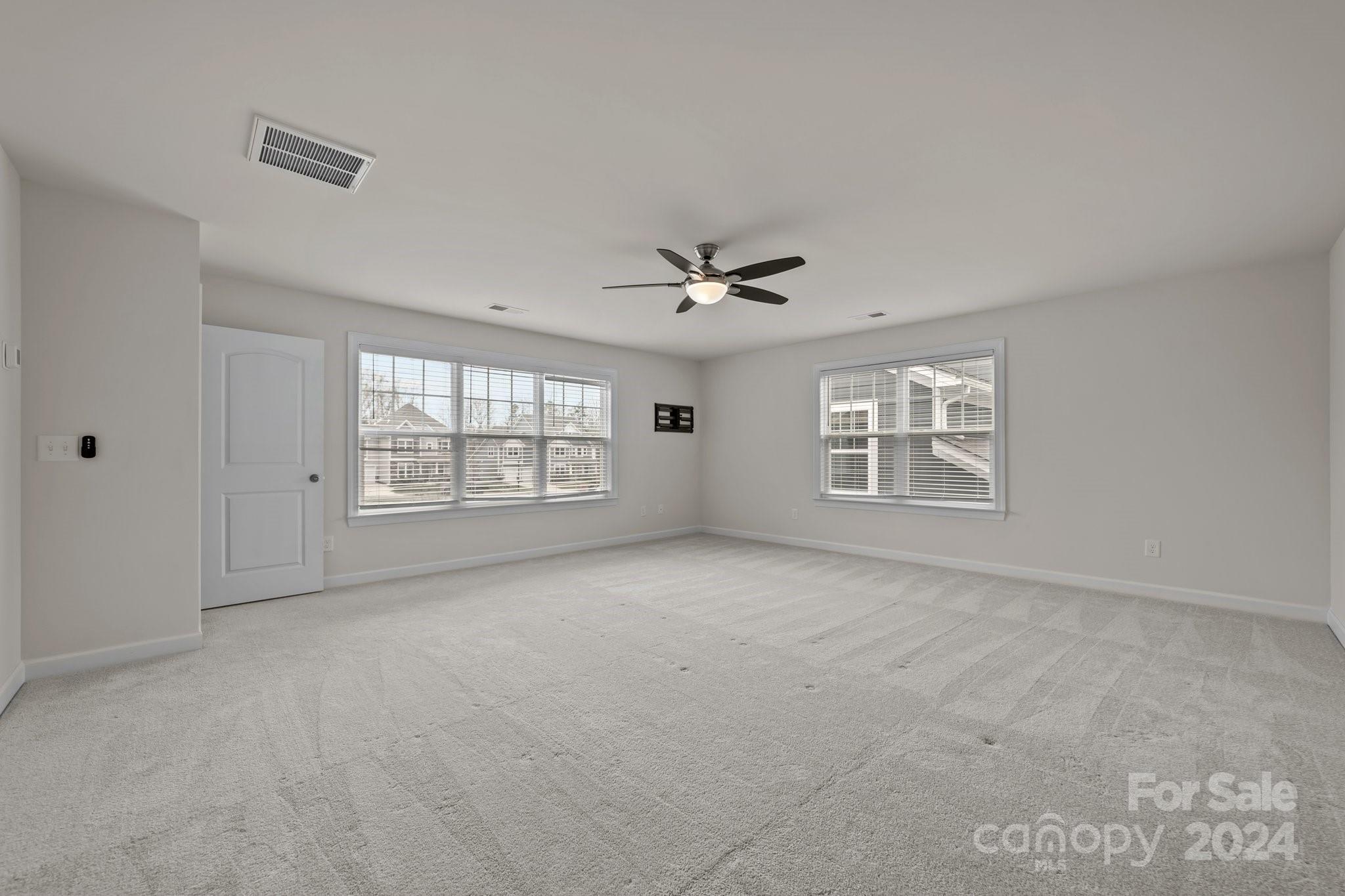 15741 Queens Trail Drive Davidson, NC 28036 - Photo 44 of 48 a view of an empty room with a window
