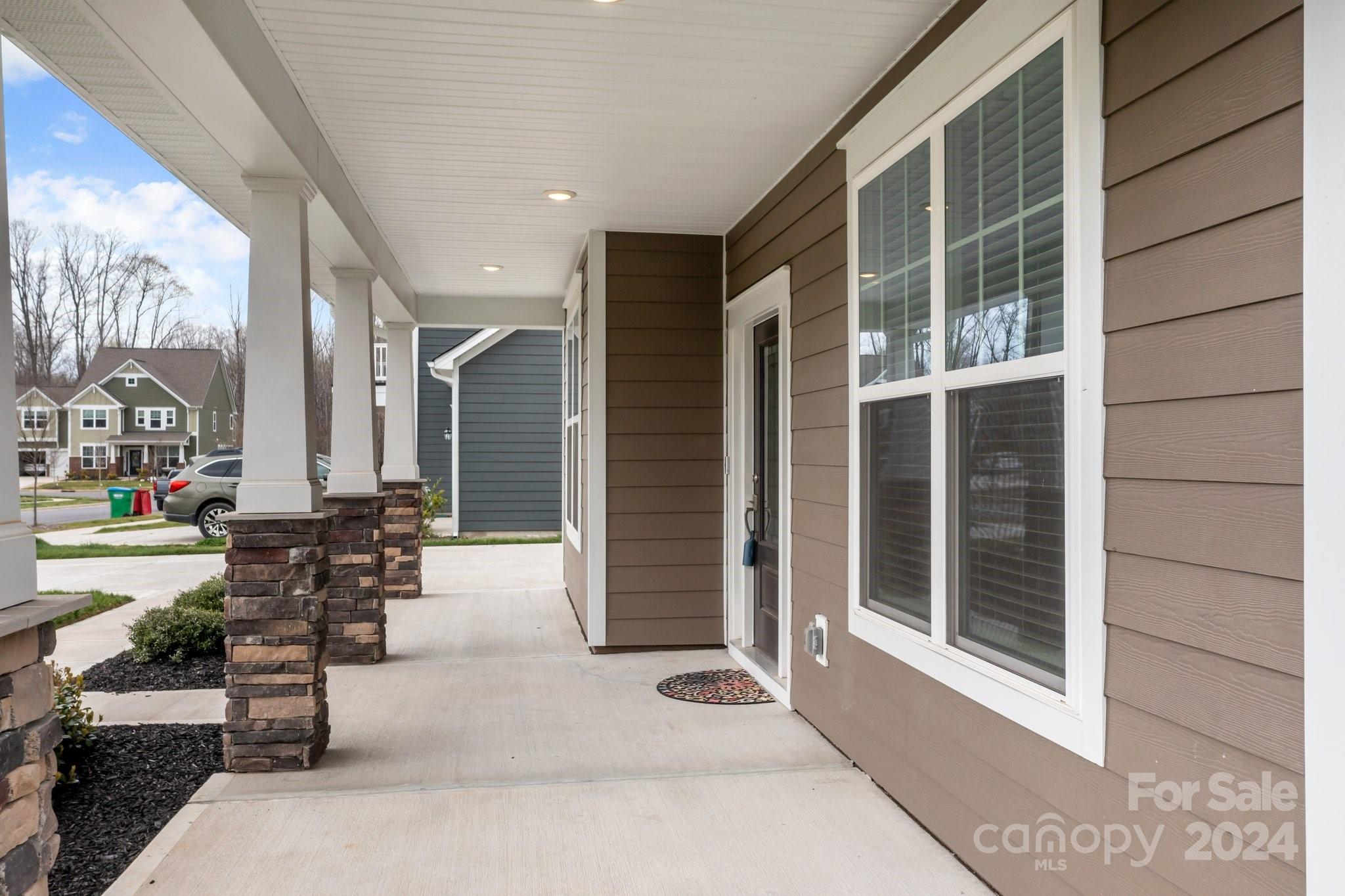 15741 Queens Trail Drive Davidson, NC 28036 - Photo 45 of 48 a building outdoor space with patio furniture