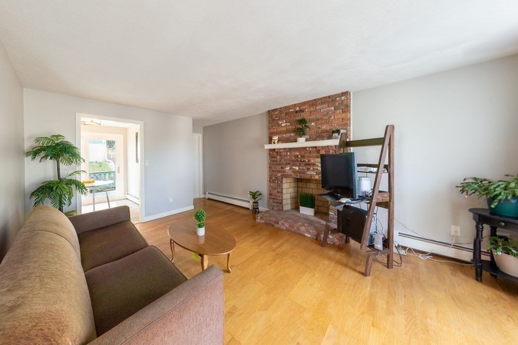 6 King Street Arlington, MA 02474 - Photo 12 of 37 a living room with furniture and a flat screen tv