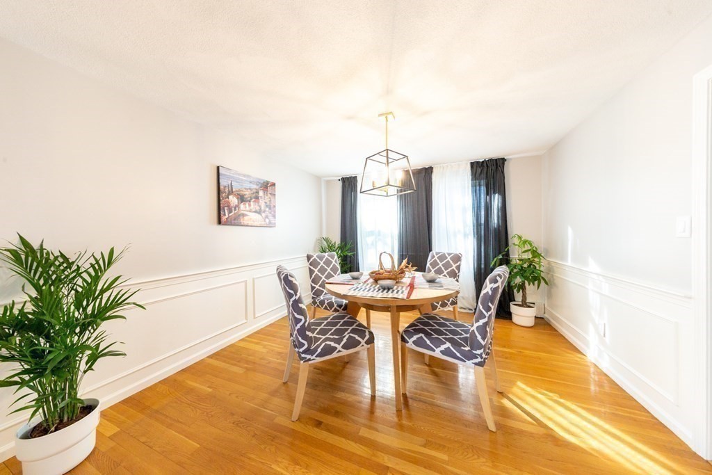 6 King Street Arlington, MA 02474 - Photo 13 of 37 a living room with furniture and a table