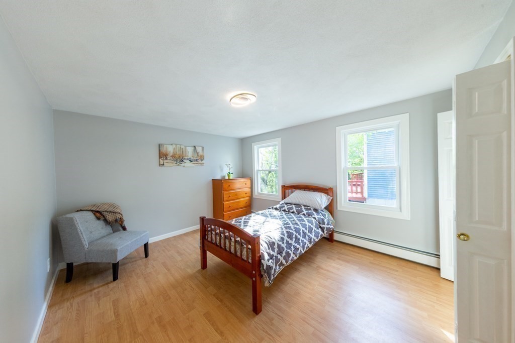 6 King Street Arlington, MA 02474 - Photo 26 of 37 a living room with furniture and a window