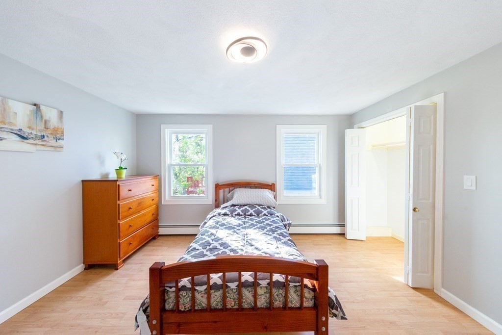 6 King Street Arlington, MA 02474 - Photo 27 of 37 a bedroom with a bed and a dresser in it