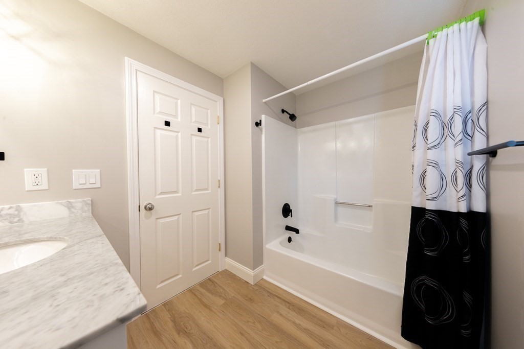 6 King Street Arlington, MA 02474 - Photo 28 of 37 a bathroom with a bathtub and a shower