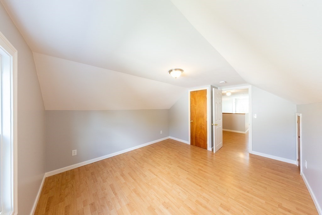 6 King Street Arlington, MA 02474 - Photo 32 of 37 a view of a big room with wooden floor and windows