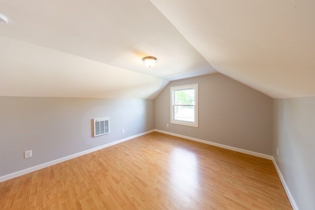 6 King Street Arlington, MA 02474 - Photo 33 of 37 an empty room with wooden floor and windows