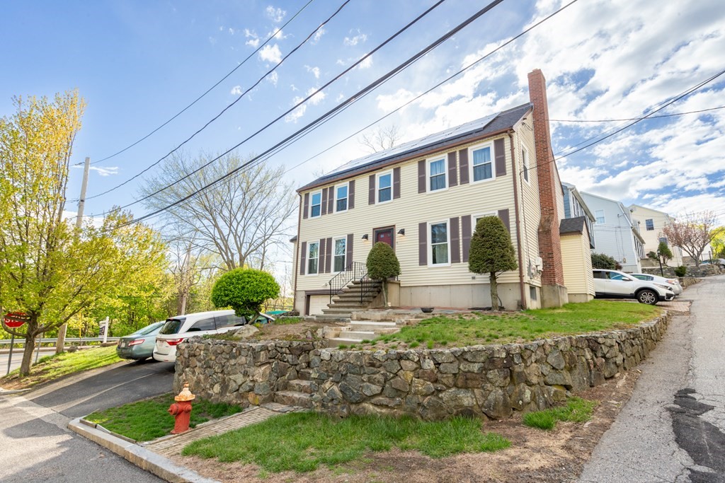 6 King Street Arlington, MA 02474 - Photo 35 of 37 a front view of a house with garden