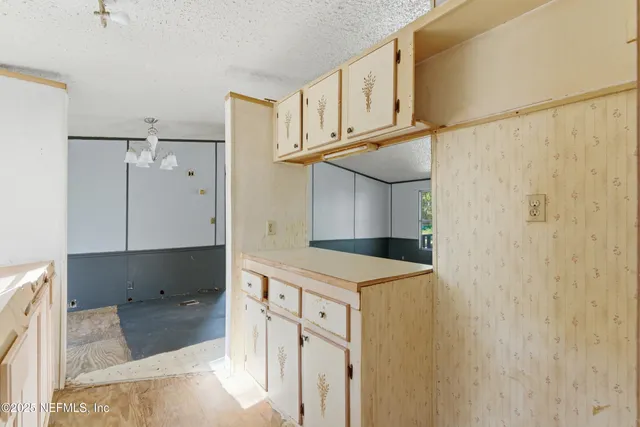 a kitchen with a cabinets and a stove