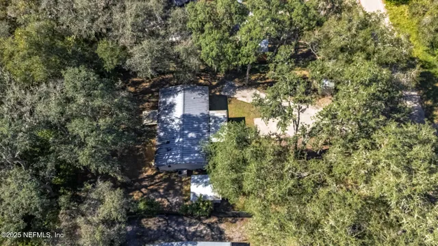 a view of a house with a tree