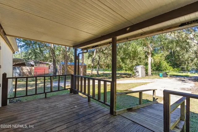 a view of porch with a swing