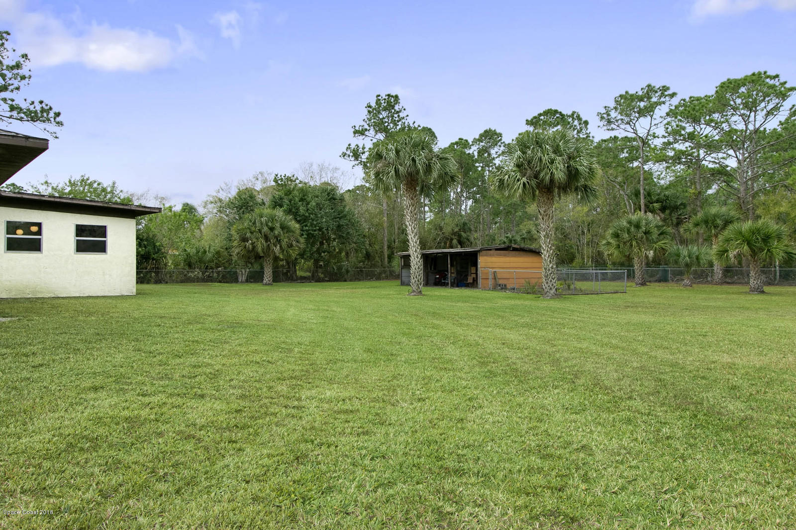3830 Corey Road Grant Valkaria, FL 32950 - Photo 24 of 38 Side Yard