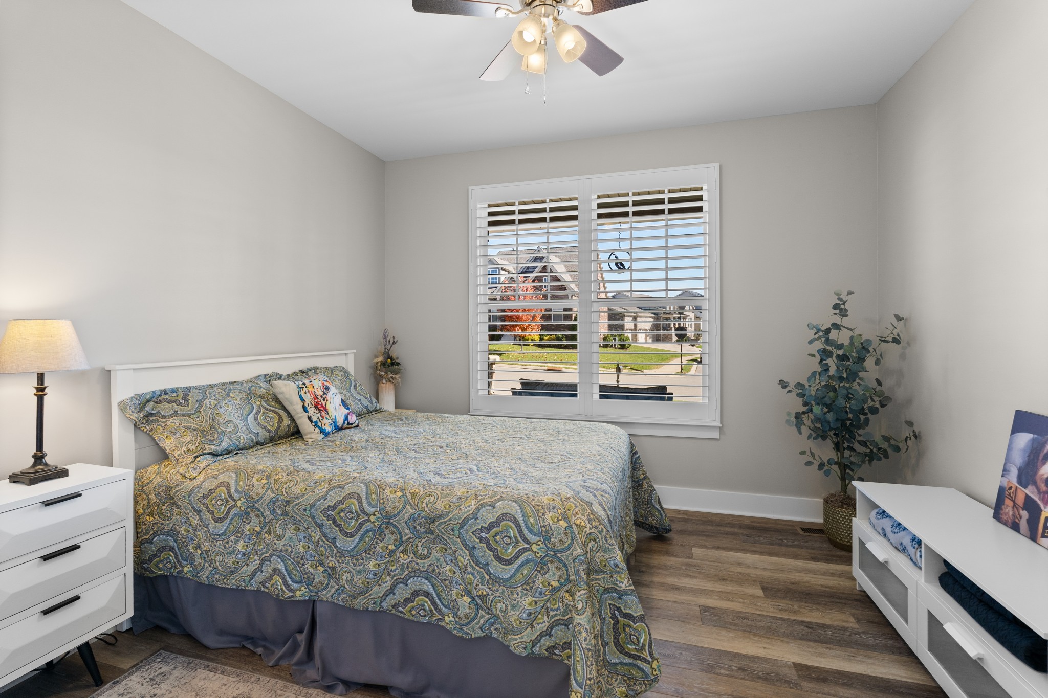 259 Caroline Way Mount Juliet, TN 37122 - Photo 18 of 35 a bedroom with a bed and a chandelier
