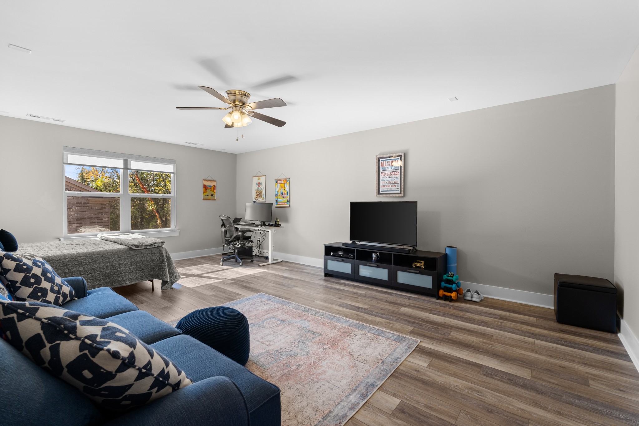 259 Caroline Way Mount Juliet, TN 37122 - Photo 20 of 35 a living room with furniture and a flat screen tv with wooden floor
