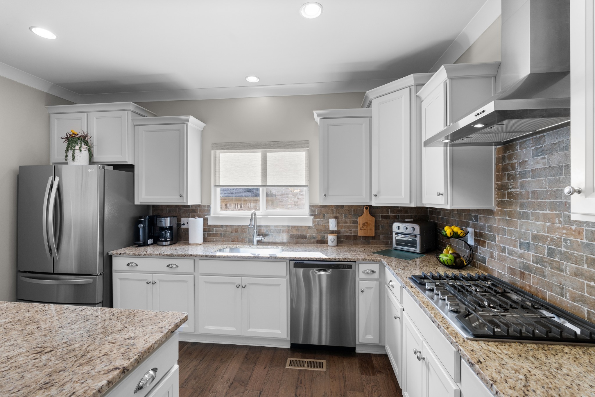 259 Caroline Way Mount Juliet, TN 37122 - Photo 7 of 35 a kitchen with a sink stove and refrigerator